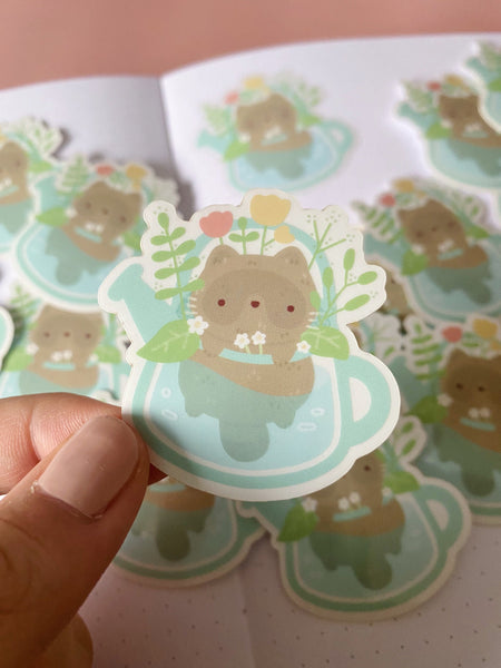 raccoon in watering can clear sticker - Hey Soosie
