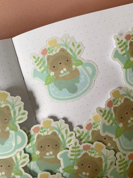 raccoon in watering can clear sticker - Hey Soosie