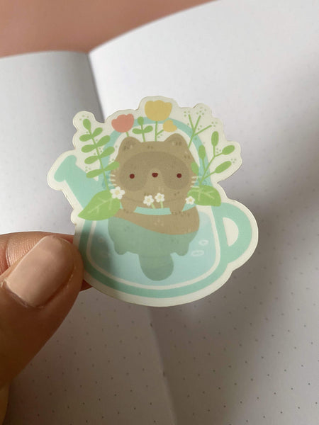 raccoon in watering can clear sticker - Hey Soosie